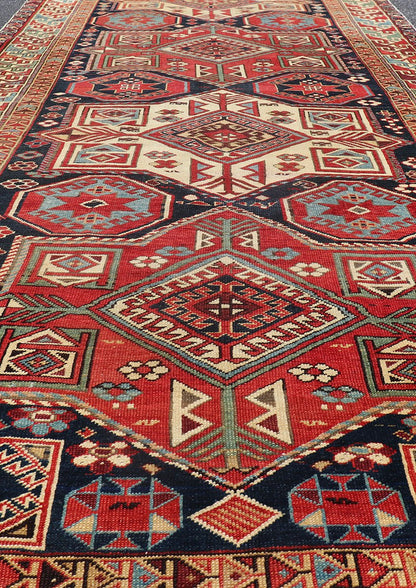Multicolored Medallions Antique Caucasian Kazak Rug with Geometrics Motifs Geometric Design Kazak Caucasian Antique rug in jewel tones with layered medallions. Keivan Woven Arts / rug 18 - 1001, country of origin / type: Caucasus Kazak rugs... - Keivan Woven Arts18 - 1001 - 10571Rug