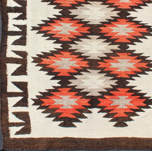 Vintage American Navajo Tribal Rug with Diamonds in Brown, Orange and Ivory This intriguing vintage Navajo rug was woven in the United States during the first half of the 20th century. The exciting and unique composition boasts a captivating geometr... - Keivan Woven Arts19 - 0203 - 11120Rug