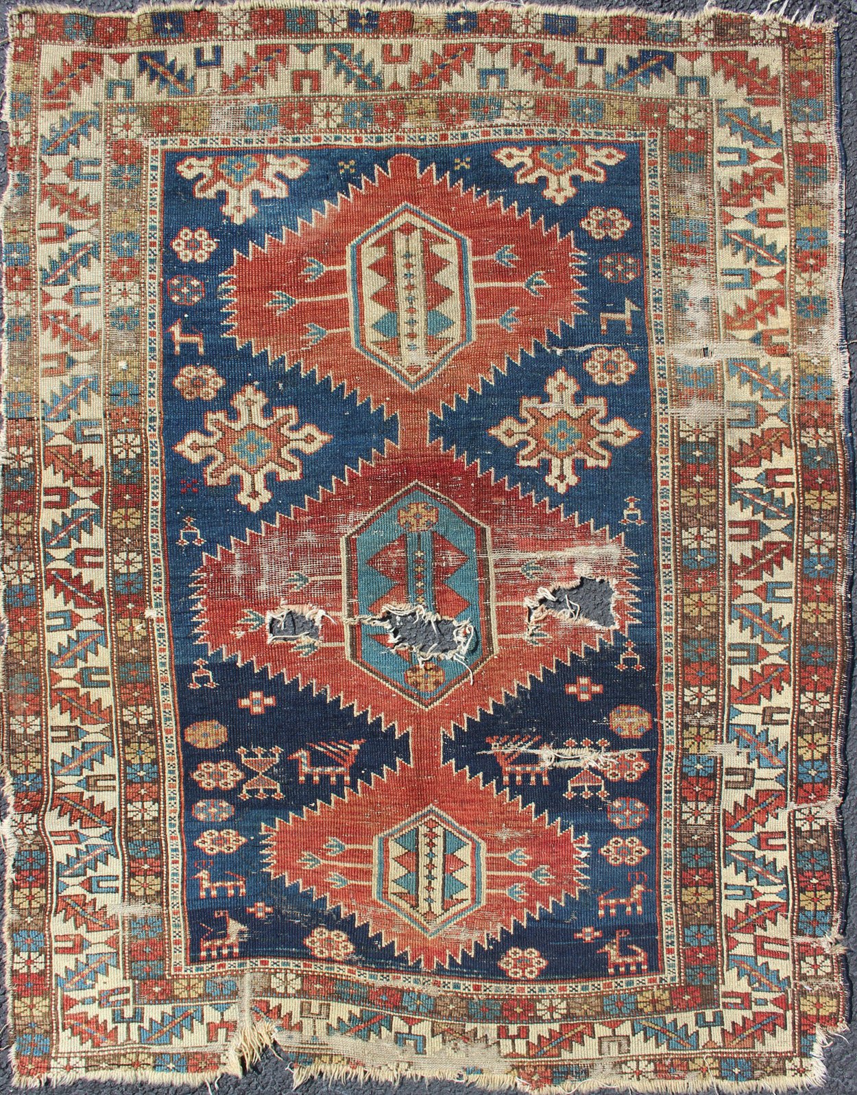 This Early Caucasian rug draws its' uniqueness from a beautiful color combination and great drawing. This rug is an early version of Shirvan and could greatly benefit from a proper restoration 3'3 x 4'3 - Keivan Woven Arts19 - 0205 - 11124Rug