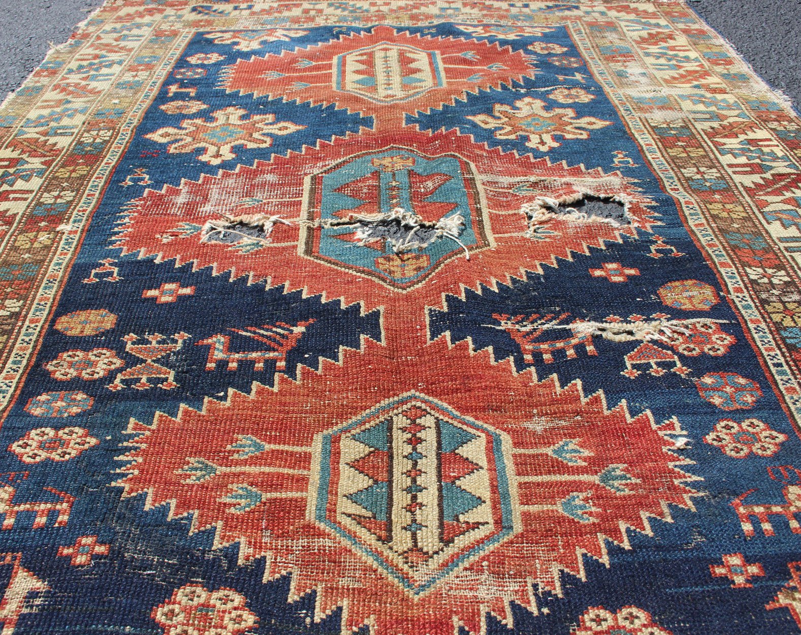 This Early Caucasian rug draws its' uniqueness from a beautiful color combination and great drawing. This rug is an early version of Shirvan and could greatly benefit from a proper restoration 3'3 x 4'3 - Keivan Woven Arts19 - 0205 - 11124Rug