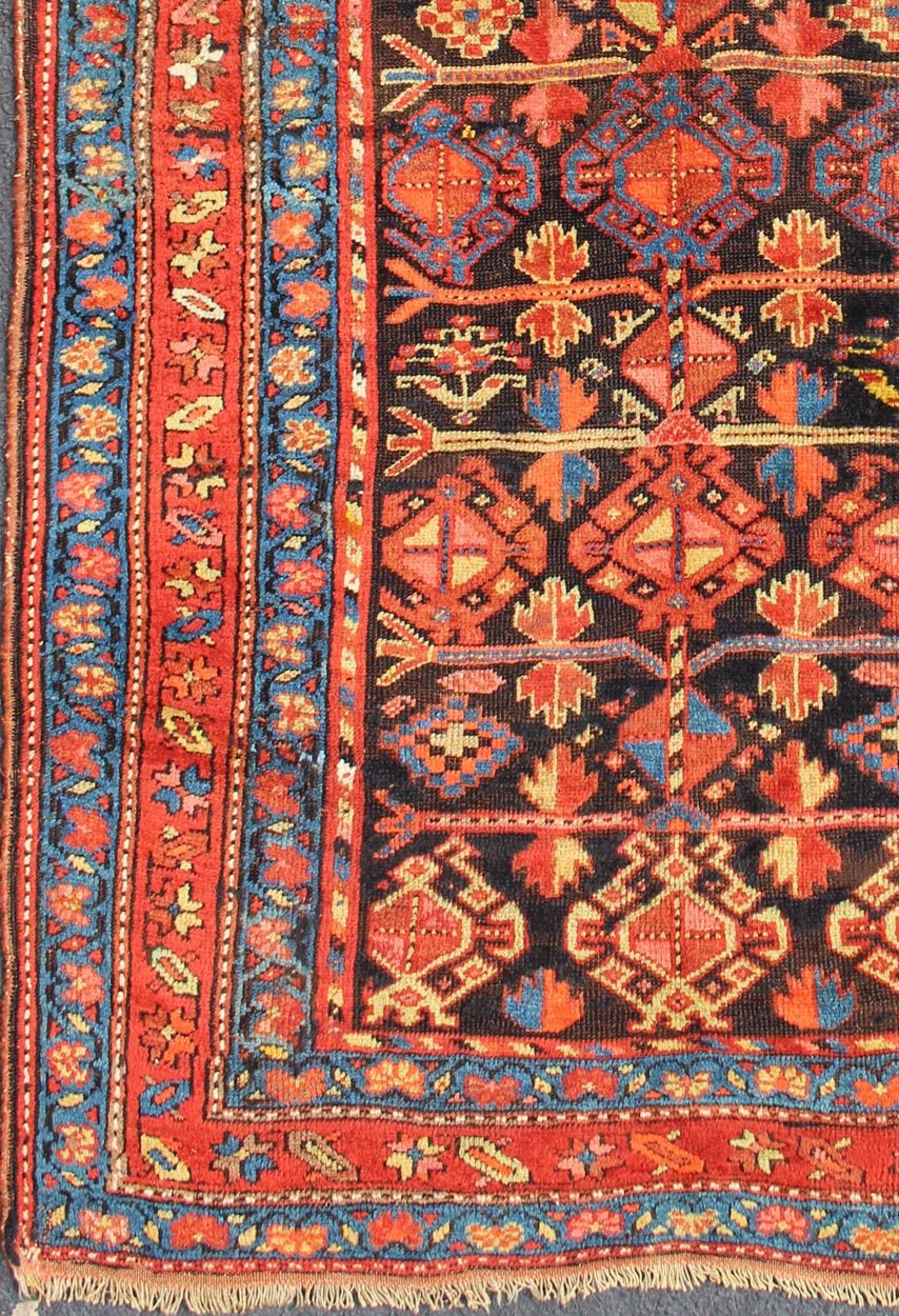 All - Over Tribal Design Antique Persian Tribal Kurdish Rug in Blue & Red Terracotta Red, Salmon Brick Red Navy Blue, Green. Yellow and medium blue Persian antique tribal Kurdish rug, rug 19 - 0207, country of origin / type: Iran / Kurdish, circa 1900. ... - Keivan Woven Arts19 - 0207 - 11134Rug