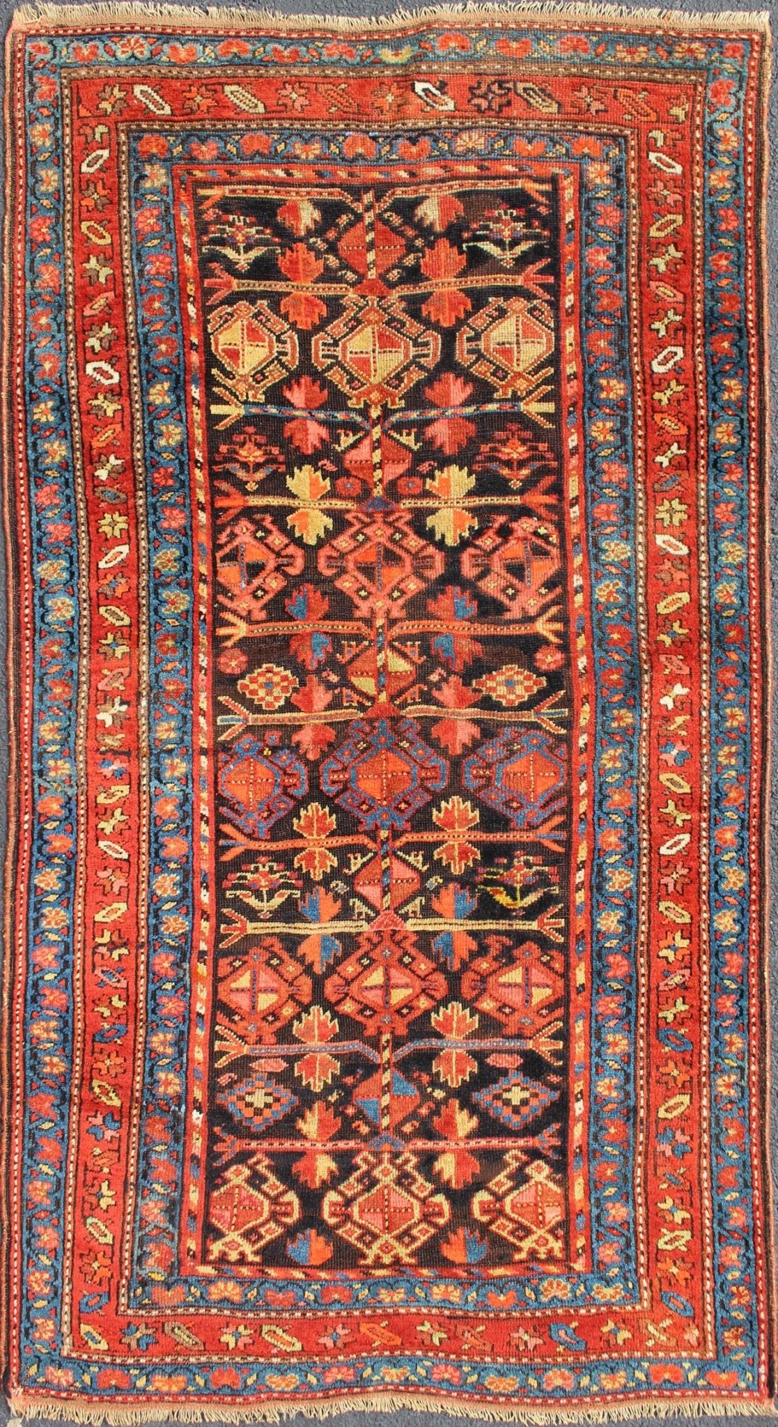 All - Over Tribal Design Antique Persian Tribal Kurdish Rug in Blue & Red Terracotta Red, Salmon Brick Red Navy Blue, Green. Yellow and medium blue Persian antique tribal Kurdish rug, rug 19 - 0207, country of origin / type: Iran / Kurdish, circa 1900. ... - Keivan Woven Arts19 - 0207 - 11134Rug