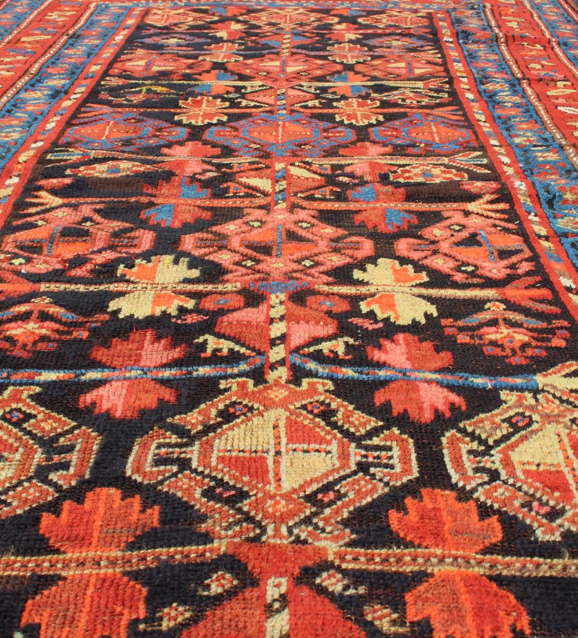 All - Over Tribal Design Antique Persian Tribal Kurdish Rug in Blue & Red Terracotta Red, Salmon Brick Red Navy Blue, Green. Yellow and medium blue Persian antique tribal Kurdish rug, rug 19 - 0207, country of origin / type: Iran / Kurdish, circa 1900. ... - Keivan Woven Arts19 - 0207 - 11134Rug