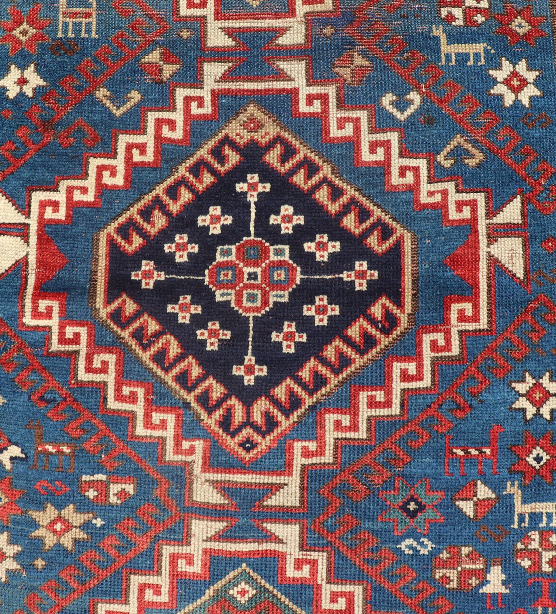 Remarkable Antique Caucasian Kazak Rug in Brilliant Blue with Geometric Design. Tribal geometric medallion design Kazak antique rug, antique Caucasian from Caucasus Region with a beautiful blue background in multi - colors. Keivan Woven Arts / rug... - Keivan Woven Arts19 - 0601 - 11350Rug