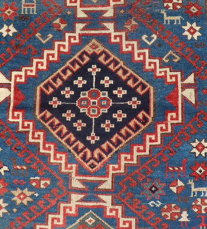 Remarkable Antique Caucasian Kazak Rug in Brilliant Blue with Geometric Design. Tribal geometric medallion design Kazak antique rug, antique Caucasian from Caucasus Region with a beautiful blue background in multi - colors. Keivan Woven Arts / rug... - Keivan Woven Arts19 - 0601 - 11350Rug