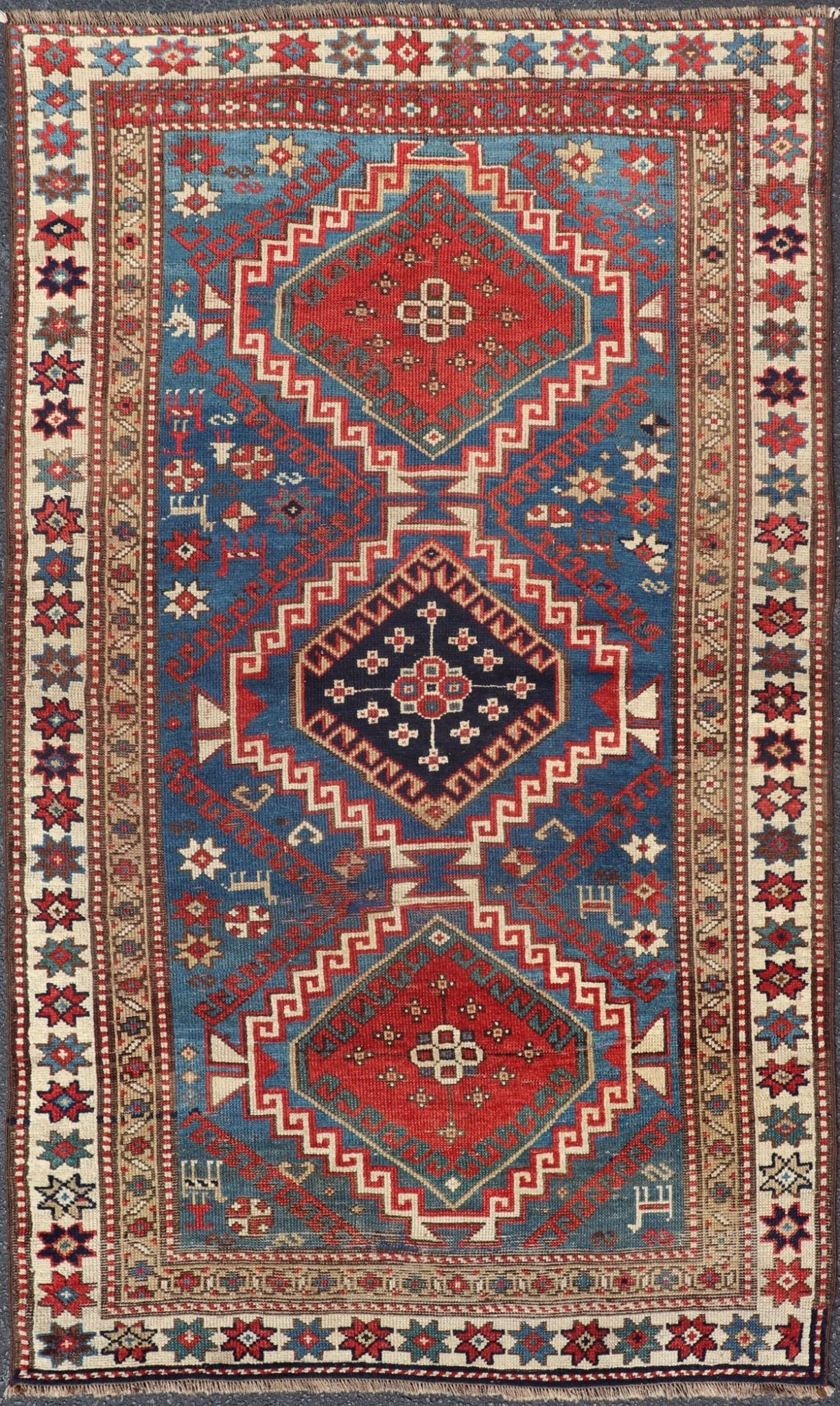 Remarkable Antique Caucasian Kazak Rug in Brilliant Blue with Geometric Design. Tribal geometric medallion design Kazak antique rug, antique Caucasian from Caucasus Region with a beautiful blue background in multi - colors. Keivan Woven Arts / rug... - Keivan Woven Arts19 - 0601 - 11350Rug