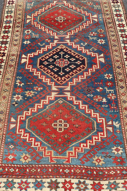 Remarkable Antique Caucasian Kazak Rug in Brilliant Blue with Geometric Design. Tribal geometric medallion design Kazak antique rug, antique Caucasian from Caucasus Region with a beautiful blue background in multi - colors. Keivan Woven Arts / rug... - Keivan Woven Arts19 - 0601 - 11350Rug