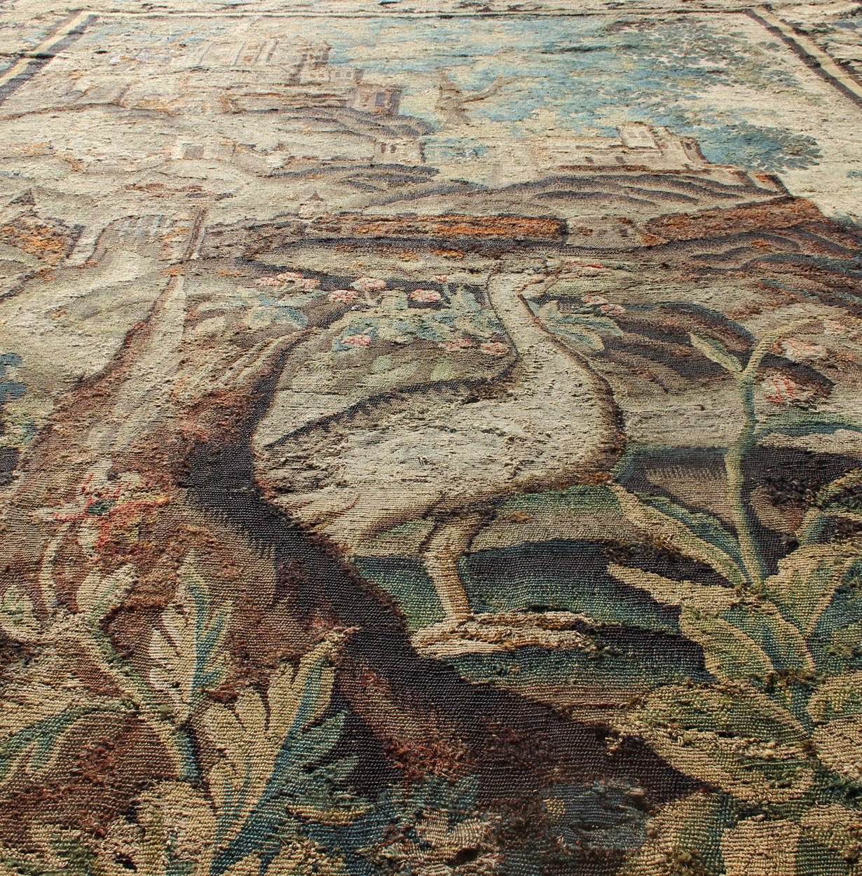 Antique 17th Century Scenic Tapestry with Abundant Vegetation and Floral Border. This wonderful antique 17th century tapestry beautifully illustrates the remarkable sense of depth and richness that was perfected by artisans of the 17th century. A r... - Keivan Woven Arts19 - 0803 - 11511Rug