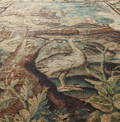 Antique 17th Century Scenic Tapestry with Abundant Vegetation and Floral Border. This wonderful antique 17th century tapestry beautifully illustrates the remarkable sense of depth and richness that was perfected by artisans of the 17th century. A r... - Keivan Woven Arts19 - 0803 - 11511Rug