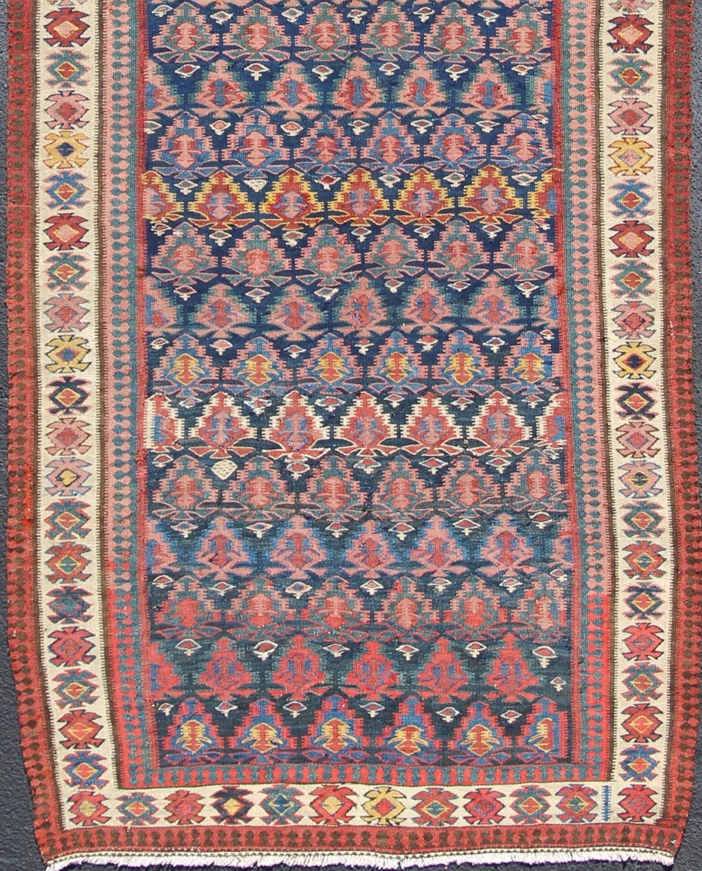 Antique Hand Woven Persian Seneh Kilim Gallery Runner With Geometric and Floral Design Vibrant runner with a beautiful blue color - toned, Geometric Design Kilim Runner antique Kilim Gallery from Persia, Keivan Woven Arts /rug 19 - 0805, country... - Keivan Woven Arts19 - 0805 - 11559Rug