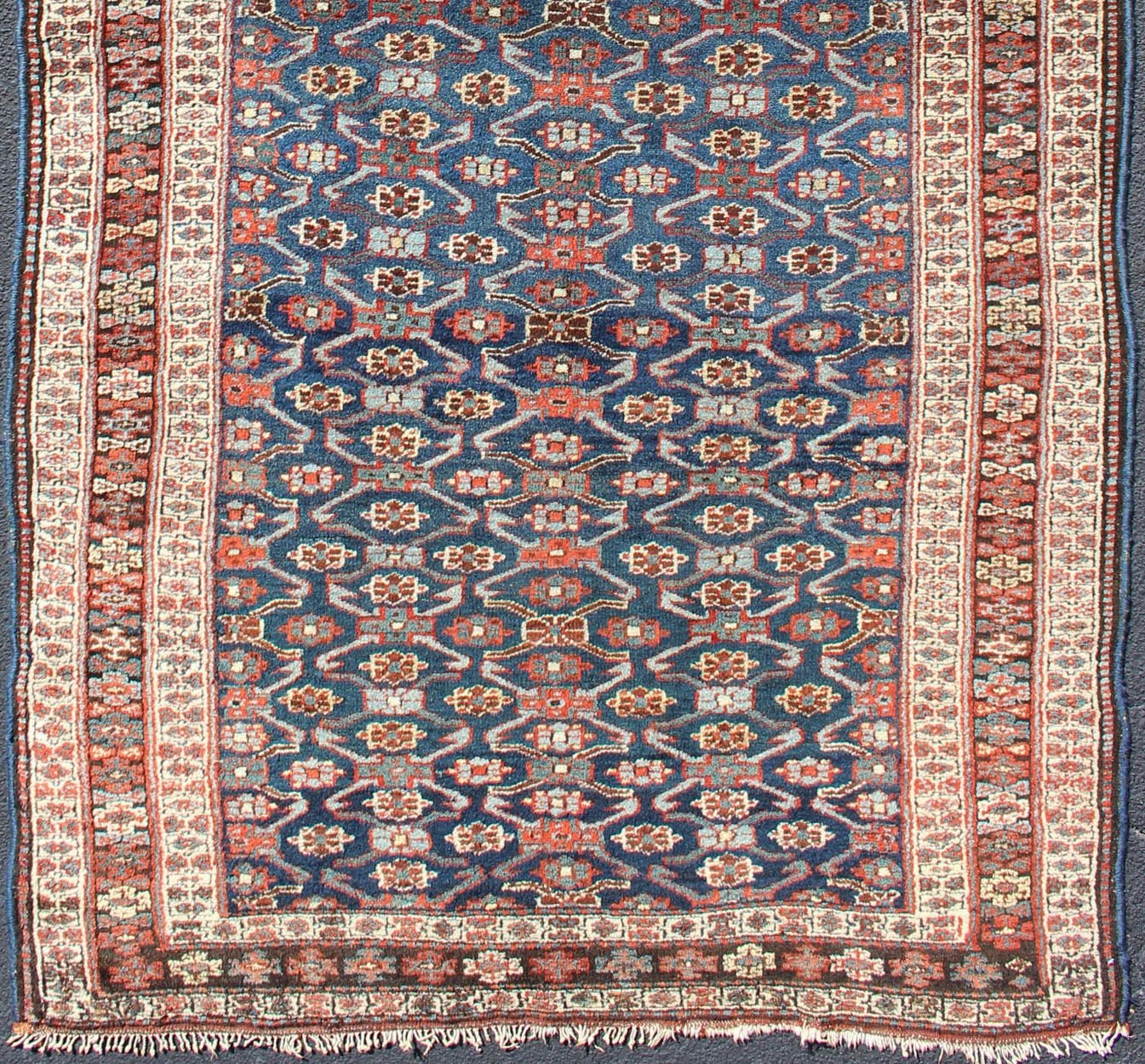 Antique Kurdish Gallery Rug with All - Over Geometric large scale Herati Design in Steel Blue Background, cream and brown border, with accent colors of red, blue, green, ivory and Light blue, Keivan Woven Arts/rug 19 - 0808, country of origin / type: Iran ... - Keivan Woven Arts19 - 0808 - 11575Rug