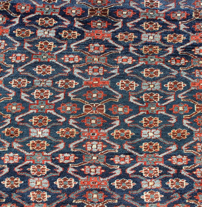Antique Kurdish Gallery Rug with All - Over Geometric large scale Herati Design in Steel Blue Background, cream and brown border, with accent colors of red, blue, green, ivory and Light blue, Keivan Woven Arts/rug 19 - 0808, country of origin / type: Iran ... - Keivan Woven Arts19 - 0808 - 11575Rug