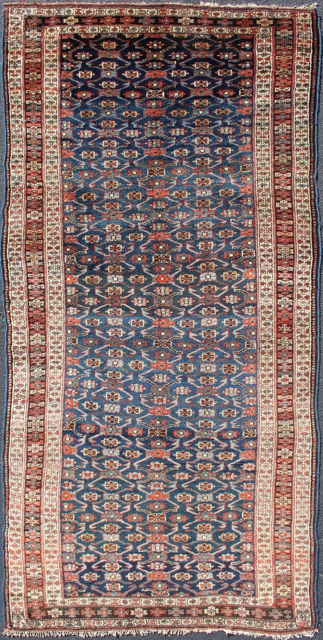 Antique Kurdish Gallery Rug with All - Over Geometric large scale Herati Design in Steel Blue Background, cream and brown border, with accent colors of red, blue, green, ivory and Light blue, Keivan Woven Arts/rug 19 - 0808, country of origin / type: Iran ... - Keivan Woven Arts19 - 0808 - 11575Rug