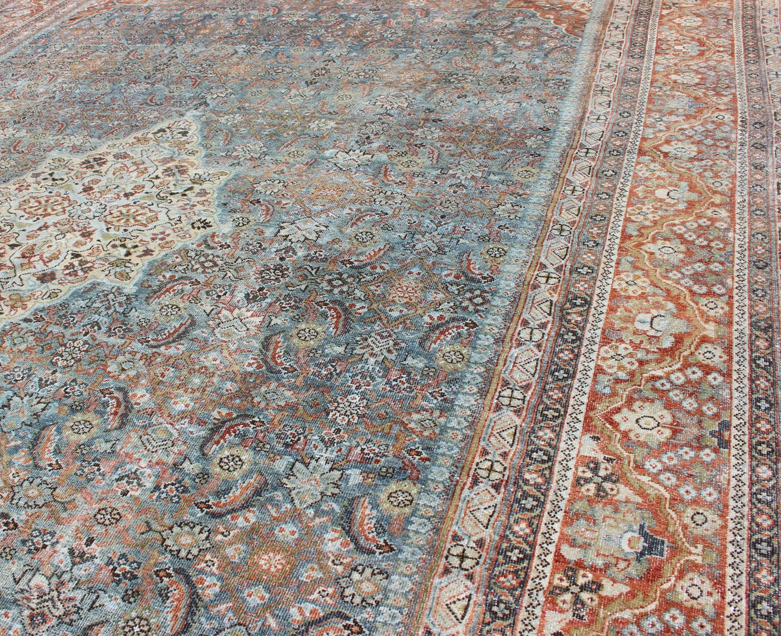 Distressed Antique Persian Sultanabad Rug in Steel Blue Background, Green, Red. Sultanabad Mahal antique rug from Persia with all - over geometric design and small medallion and four cornices. Keivan Woven Arts/ rug 1912 - 175, country of origin / type: Ir... - Keivan Woven Arts1912 - 175 - 12267Rug