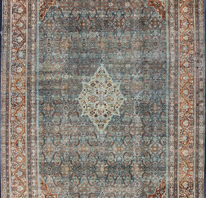 Distressed Antique Persian Sultanabad Rug in Steel Blue Background, Green, Red. Sultanabad Mahal antique rug from Persia with all - over geometric design and small medallion and four cornices. Keivan Woven Arts/ rug 1912 - 175, country of origin / type: Ir... - Keivan Woven Arts1912 - 175 - 12267Rug