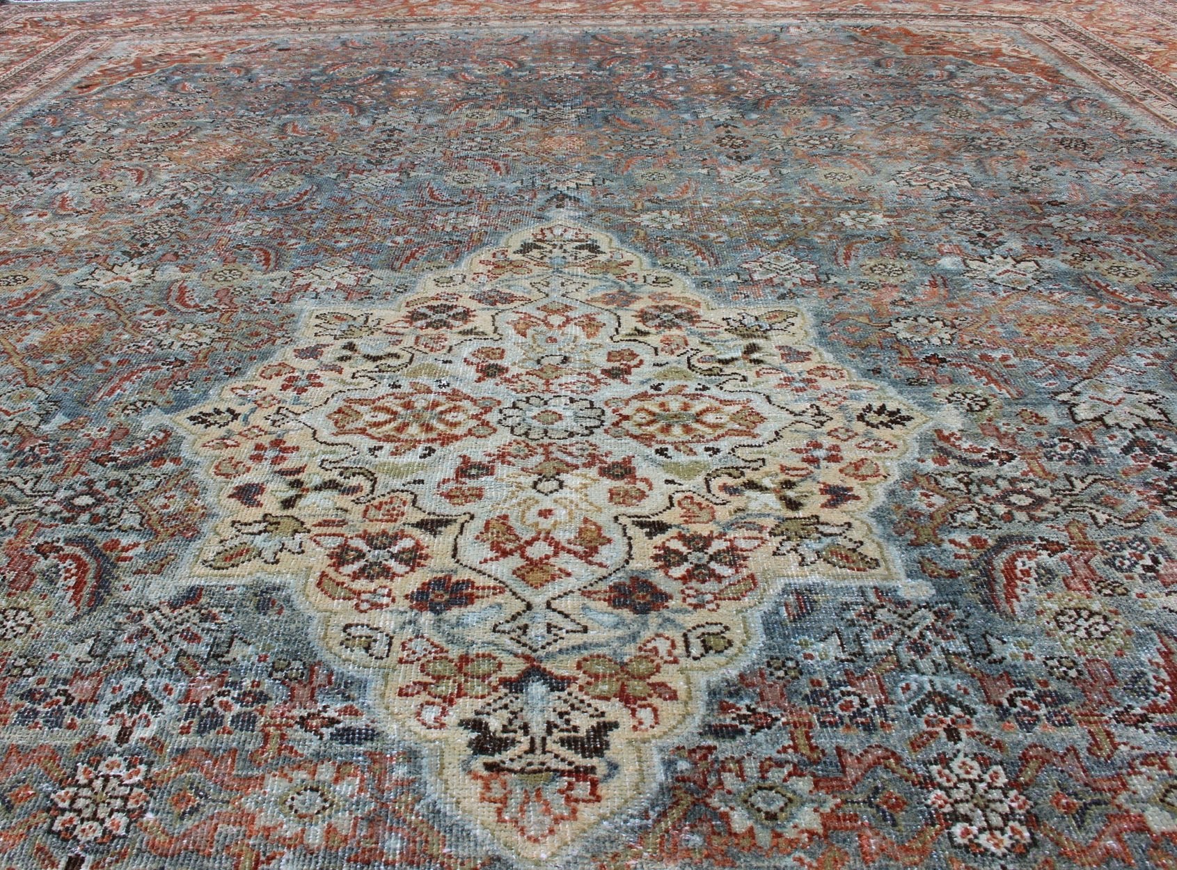 Distressed Antique Persian Sultanabad Rug in Steel Blue Background, Green, Red. Sultanabad Mahal antique rug from Persia with all - over geometric design and small medallion and four cornices. Keivan Woven Arts/ rug 1912 - 175, country of origin / type: Ir... - Keivan Woven Arts1912 - 175 - 12267Rug