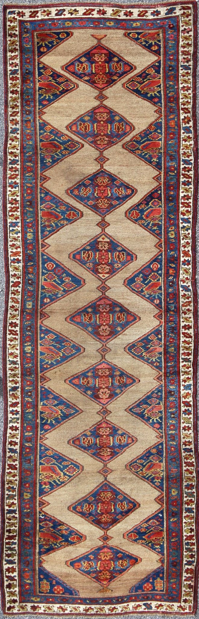 Colorful Long Antique Persian Serab Runner with Camel, Blue, Red and Brown The navy blue and camel field in this piece is decorated with multicolored strap work, lattice work and stylized Boteh and floral elements. Beautifully drawn ivory and bl... - Keivan Woven Arts20940 - 1438Rug
