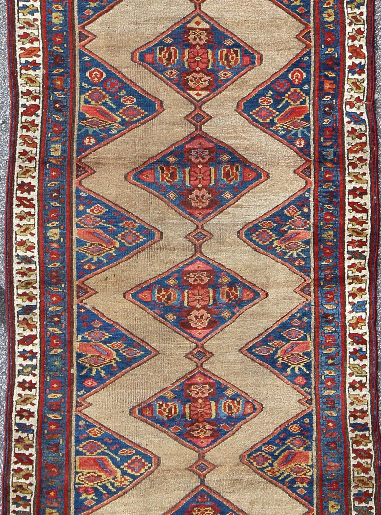 Colorful Long Antique Persian Serab Runner with Camel, Blue, Red and Brown The navy blue and camel field in this piece is decorated with multicolored strap work, lattice work and stylized Boteh and floral elements. Beautifully drawn ivory and bl... - Keivan Woven Arts20940 - 1438Rug