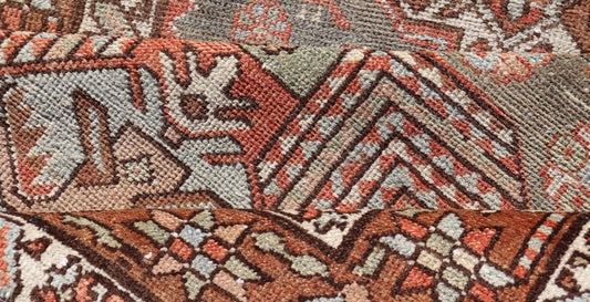 Measures: 3'4 x 15'2 
 
 Antique Persian Long Serapi Runner with Multi Medallions in Green, Blue, Orange. 
 
 Keivan Woven Arts / rug/EMB-22106-15050 country of origin / type: Iran / Karadjeh, circa 1910
 
 This magnificent Persian Searpi-Heriz bears a...