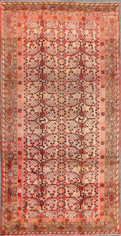 Antique Khotan Rug
 
 
 
 This attractive antique Khotan rug is a spectacular testament to the complexity of Turkestan design. The neutral tone of the central field plays host to a stunning display of the entwined tree of life bearing budding blossoms ...