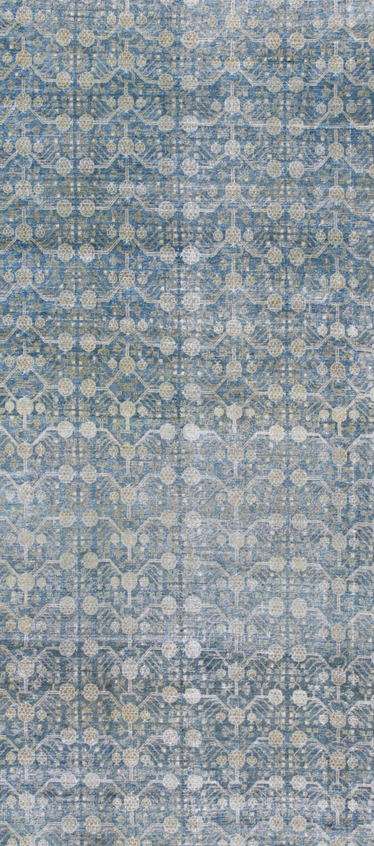 Antique Khotan rug with blue all-over design of blossoms and flowers, large Khotan from Turkestan rug sus-1803-387, country of origin / type: Turkestan / Khotan, circa 1910
 
 
 
 This attractive antique Khotan rug (circa 1910) is a spectacular testame...