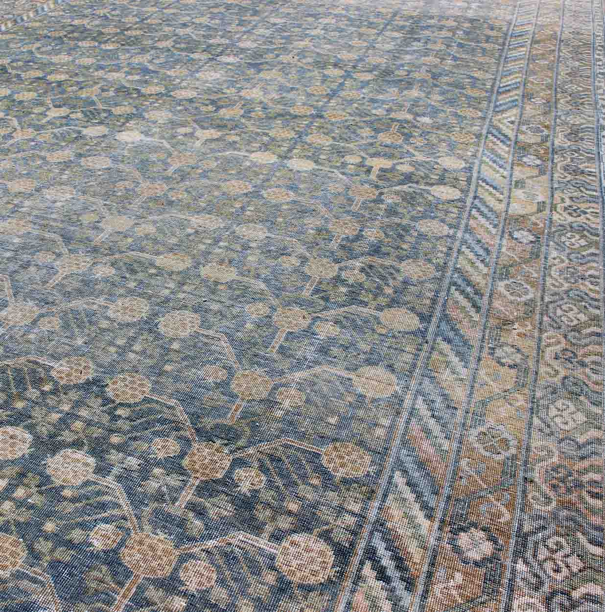 Antique Khotan rug with blue all-over design of blossoms and flowers, large Khotan from Turkestan rug sus-1803-387, country of origin / type: Turkestan / Khotan, circa 1910
 
 
 
 This attractive antique Khotan rug (circa 1910) is a spectacular testame...