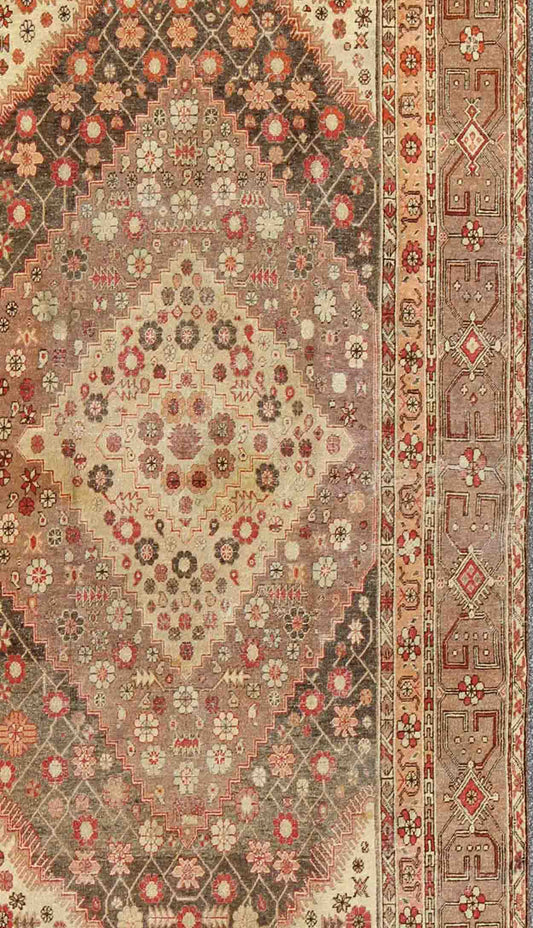 Antique Khotan Medallion Rug in Neutrals and Blush with Floral Motifs All-Over
 
 
 
 Measures: 6'4 x 11'6 
 
 
 
  This beautiful Khotan rug, from early 20th century Turkestan features layered medallions in geometric and diamond shapes. The field and ...