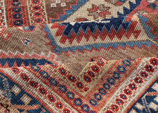 Antique Persian Kurdish Short Runner With Geometric Motifs in Light Camel Field 
 
 
 
 Antique Persian Kurdish Short Runner With Geometric Motifs in Light Camel Field Medallion design on camel field, dark blue, red, ivory, and camel.
 
 Keivan Woven A...