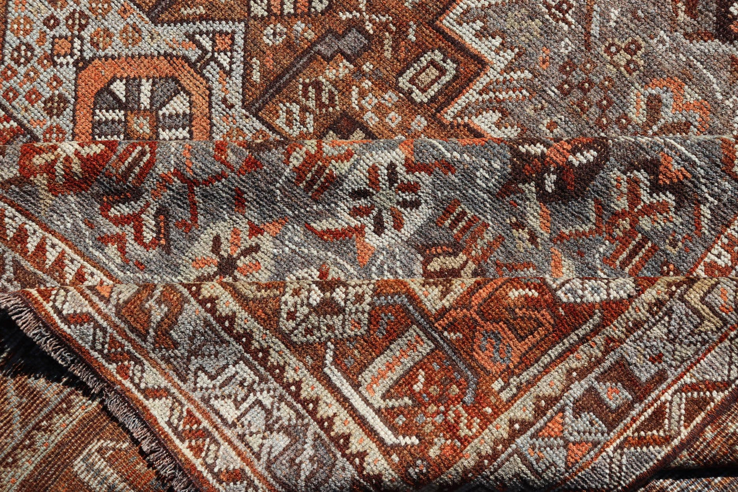 Measures: 6'10 x 9'0 
 
 Geometric Persian Shiraz Rug with Tri-Medallion Design in Shades Orange and Blue. Keivan Woven Arts / rug EMB-22132-15042, country of origin / type: Iran / Shiraz, circa 1910.
 
 
 
 This Persian Shiraz rug (circa early 20th ce...