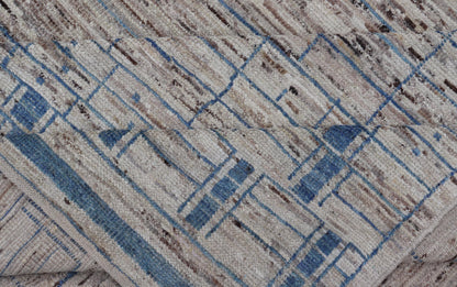 Modern Hand-Knotted Rug in Wool with Sub-Geometric Design in Blue and Cream 
 
 
 
  This modern casual tribal rug has been hand-knotted. The rug features a modern sub-geometric design, rendered in blue and cream; making this rug a superb fit for a var...