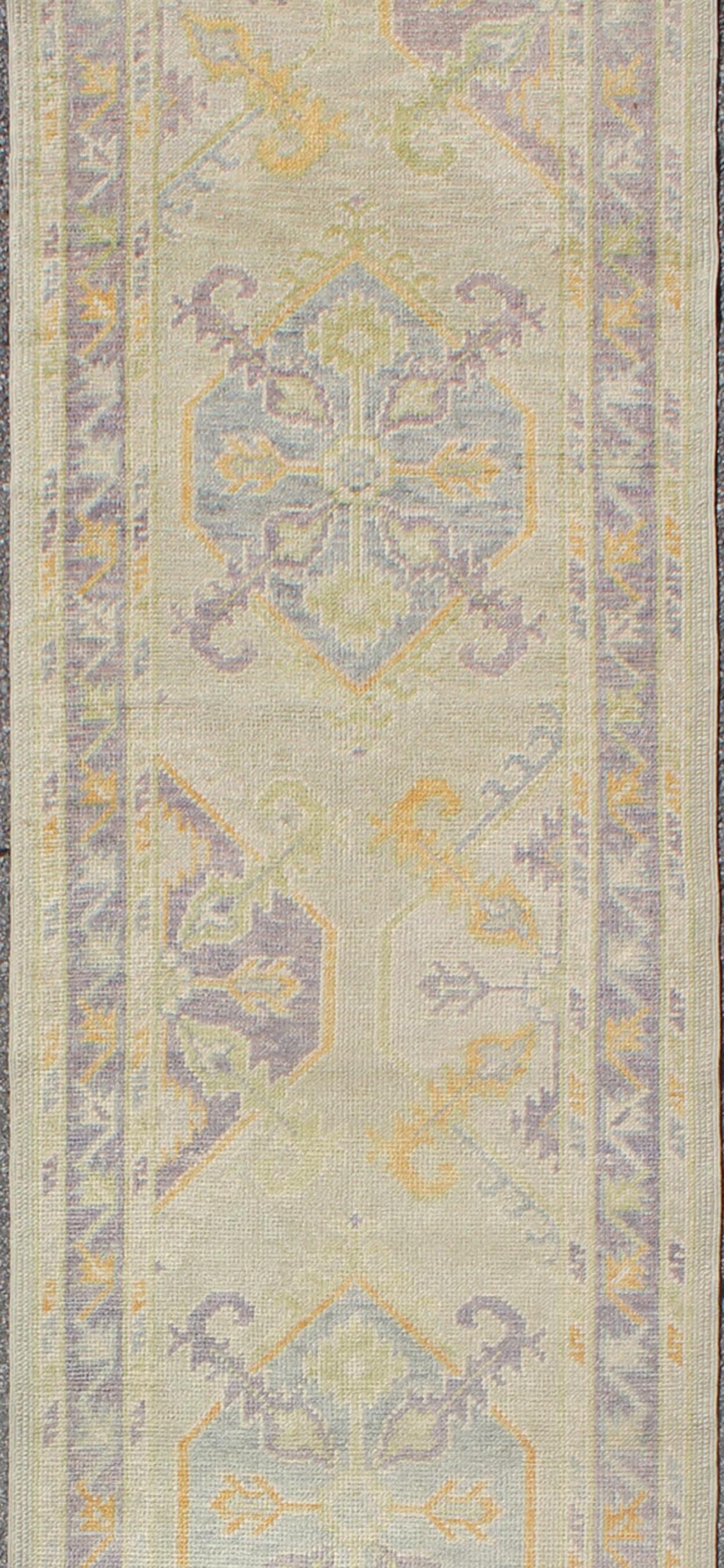 Turkish Oushak Runner with a Tribal Design in Purple, Blue and L.Green Colors kwarugs
 
 
 
 Turkish Oushak runner with purple, blue and L.Green colors and all-over Tribal design, rug en-165660, country of origin / type: Turkey / Oushak
 
 
 
 This tra...
