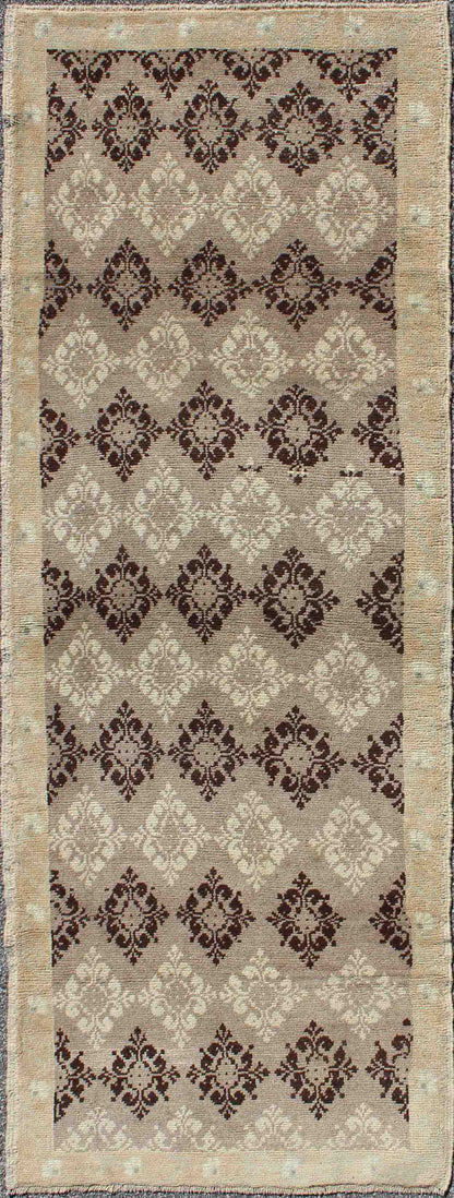 Taupe, brown, ivory vintage Turkish Oushak runner with diamond blossom motifs, rug en-1012, country of origin / type: Turkey / Oushak, circa 1940
 
 
 
 This unique Turkish Oushak carpet features an all-over design of intricate diamond-shaped botanical...