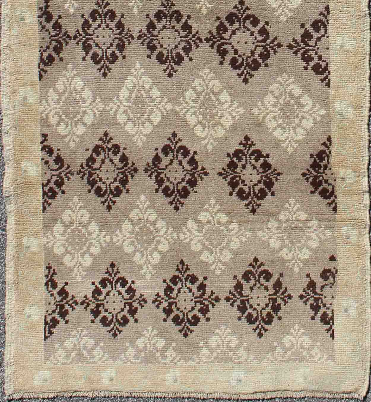 Taupe, brown, ivory vintage Turkish Oushak runner with diamond blossom motifs, rug en-1012, country of origin / type: Turkey / Oushak, circa 1940
 
 
 
 This unique Turkish Oushak carpet features an all-over design of intricate diamond-shaped botanical...