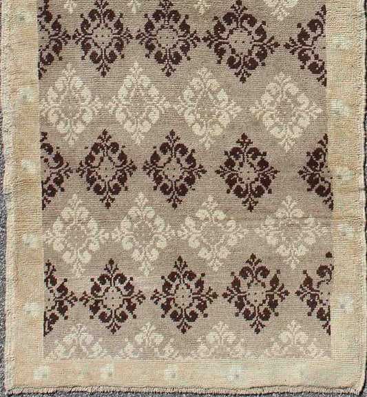 Taupe, brown, ivory vintage Turkish Oushak runner with diamond blossom motifs, rug en-1012, country of origin / type: Turkey / Oushak, circa 1940
 
 
 
 This unique Turkish Oushak carpet features an all-over design of intricate diamond-shaped botanical...