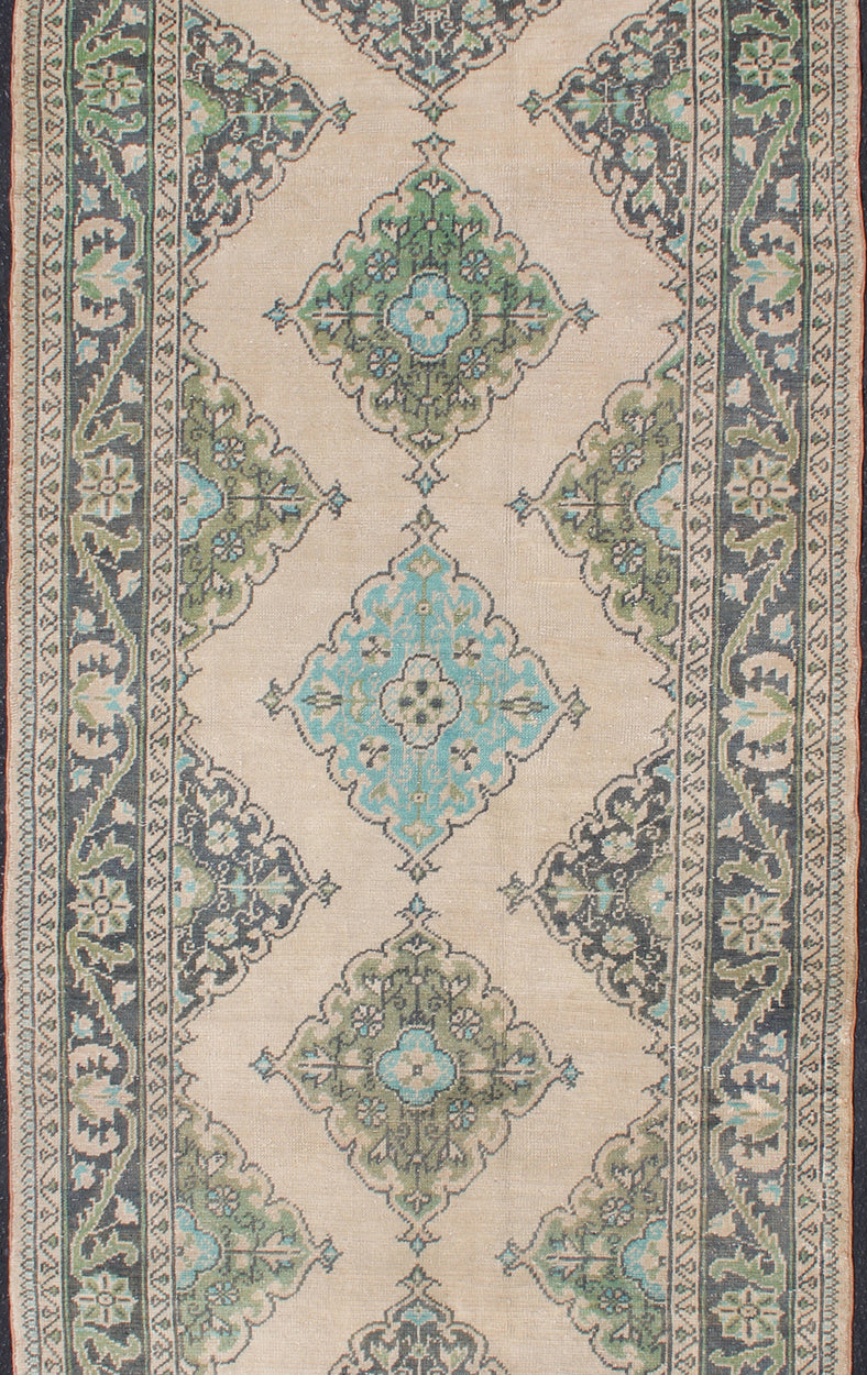 Turkish Oushak Runner With Medallion Design in Dark Blue, Blush, Aqua and Green
 
 
 
 Floral Medallion design Oushak runner from Turkey, Keivan Woven Arts / rug en-176969, country of origin / type: Turkey / Oushak, circa 1950
 
 
 
 This dynamic Ousha...