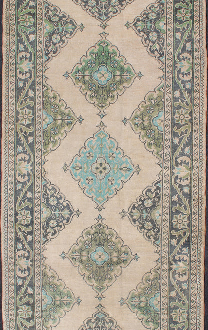 Turkish Oushak Runner With Medallion Design in Dark Blue, Blush, Aqua and Green
 
 
 
 Floral Medallion design Oushak runner from Turkey, Keivan Woven Arts / rug en-176969, country of origin / type: Turkey / Oushak, circa 1950
 
 
 
 This dynamic Ousha...