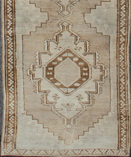 Taupe, Ivory, Brown Vintage Turkish Oushak Rug with Three Vertical Medallions, Gray, Ivory, rug mtu-3493, country of origin / type: Turkey / Oushak, circa mid-20th century.
 
 
 
 This vintage Turkish Oushak gallery rug (circa mid-20th century) feature...