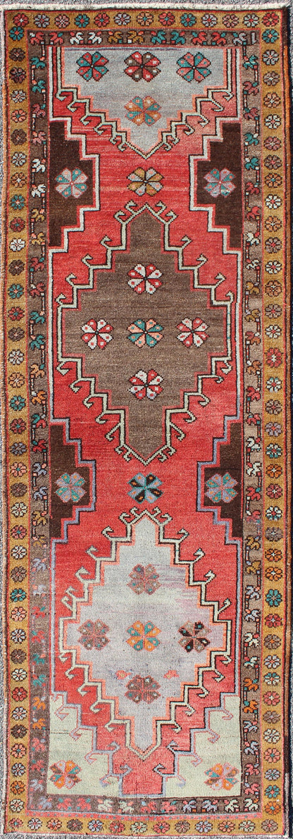 Vintage Turkish Oushak runner with Sub-geometric tribal medallions in brown, red, rug tu-TRS-3251, country of origin / type: Turkey / Oushak, circa 1940
 
 
 
 This vintage Oushak runner features a unique blend of cheerful colors and an intricately bea...