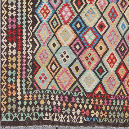 Colorful Tribal Kilim Flat Weave Rug with Chocolate Brown & Bright Multi Colors This flat - woven kilim rug from Afghanistan features a bold geometric design consisting of a variety of colors, including brown, purple, light green, teal, yellow, gr... - Keivan Woven ArtsABT - 8120937 - 8467Rug