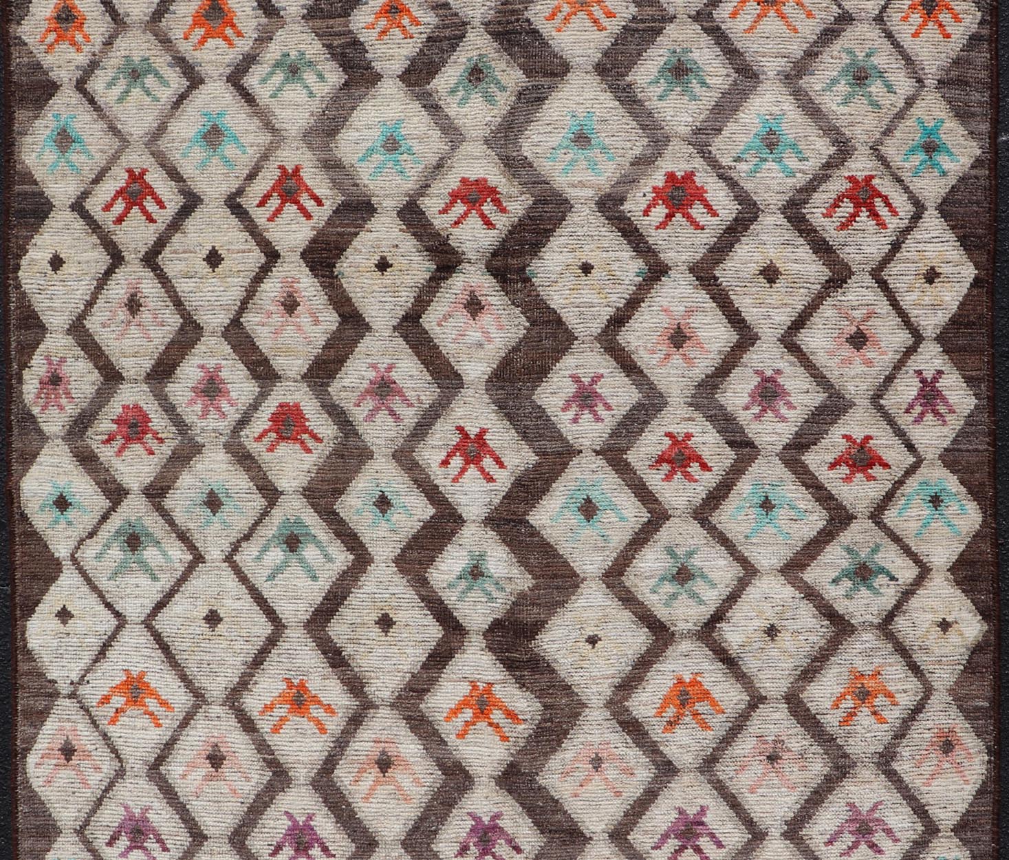 Modern Hand - Knotted Rug in Wool with Sub - Geometric Diamond Design in Multicolor This modern casual tribal rug has been hand - knotted. The rug features a modern all - over sub - geometric diamond design, replete with various motifs in multicolor, mak... - Keivan Woven ArtsAFG - 004 - 563Rug