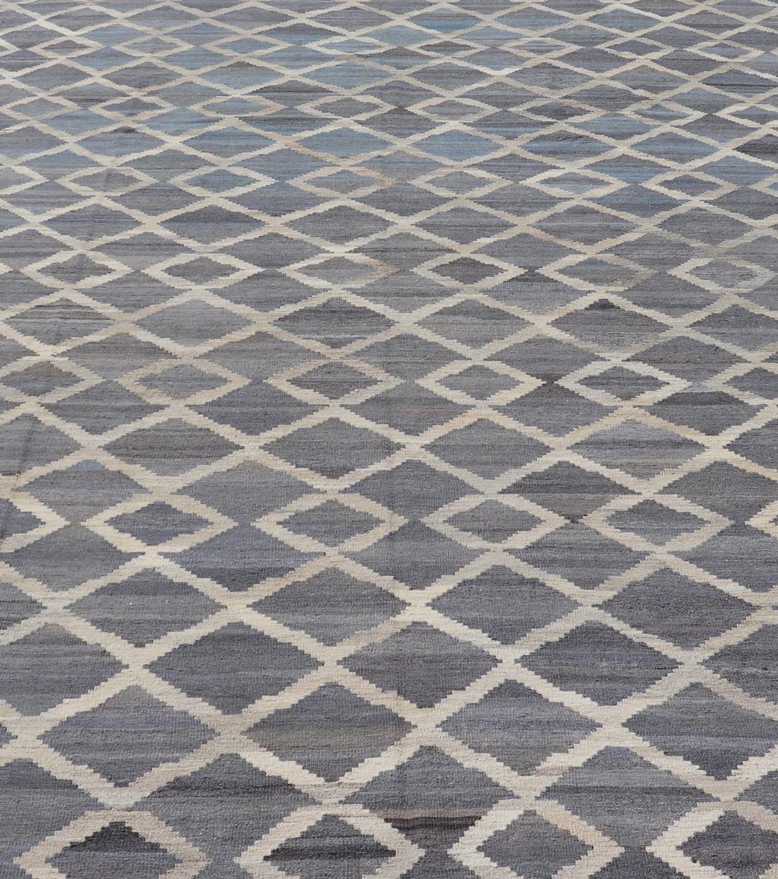 Modern Hand - Woven Kilim in Wool with Sub - Geometric Interlocked Diamond Design This modern flat - weave kilim has been hand - woven. The rug features a modern sub - geometric interlocked diamond design, rendered in blues, grays and cream; making this r... - Keivan Woven ArtsAFG - 037 - 19664Rug