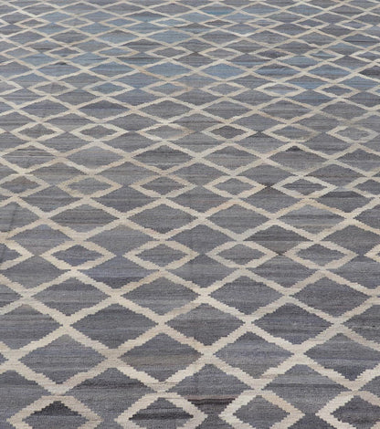 Modern Hand - Woven Kilim in Wool with Sub - Geometric Interlocked Diamond Design This modern flat - weave kilim has been hand - woven. The rug features a modern sub - geometric interlocked diamond design, rendered in blues, grays and cream; making this r... - Keivan Woven ArtsAFG - 037 - 19664Rug