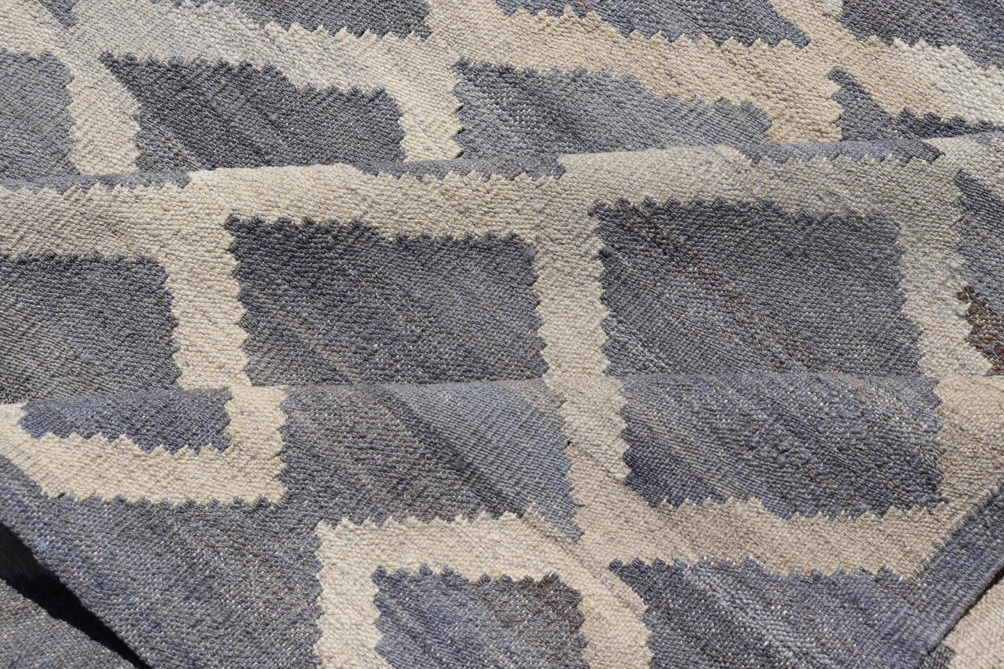 Modern Hand - Woven Kilim in Wool with Sub - Geometric Interlocked Diamond Design This modern flat - weave kilim has been hand - woven. The rug features a modern sub - geometric interlocked diamond design, rendered in blues, grays and cream; making this r... - Keivan Woven ArtsAFG - 037 - 19664Rug
