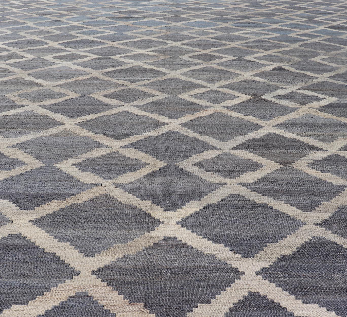 Modern Hand - Woven Kilim in Wool with Sub - Geometric Interlocked Diamond Design This modern flat - weave kilim has been hand - woven. The rug features a modern sub - geometric interlocked diamond design, rendered in blues, grays and cream; making this r... - Keivan Woven ArtsAFG - 037 - 19664Rug