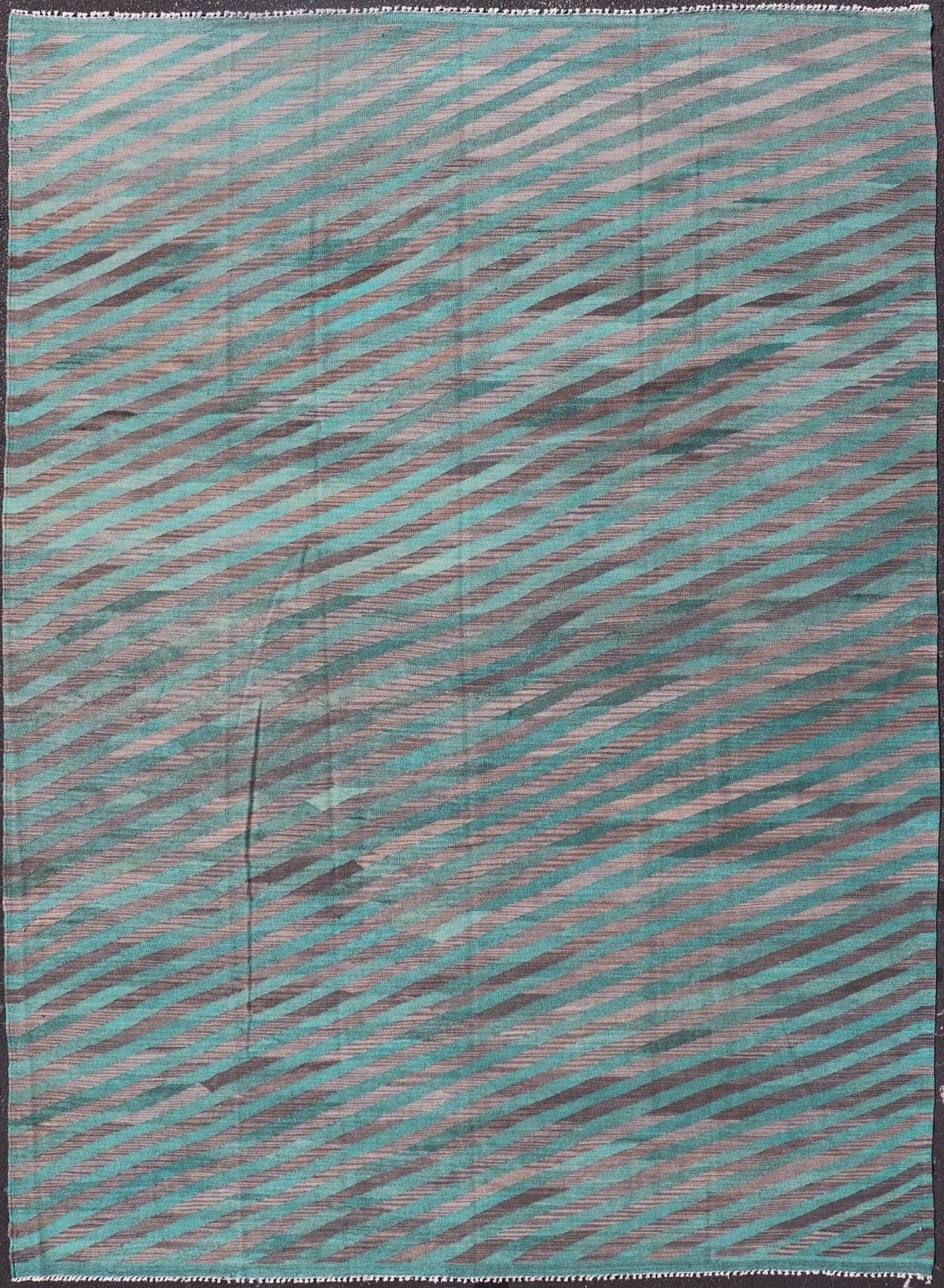 Modern Afghan Hand - Woven Kilim in Wool with Sub - Geometric Slanted Stripe Design This flat - weave kilim has been hand - woven. The rug features a modern slanted stripe design, rendered in green and shades of gray; making this rug a superb fit for a... - Keivan Woven ArtsAFG - 044 - 19676Rug