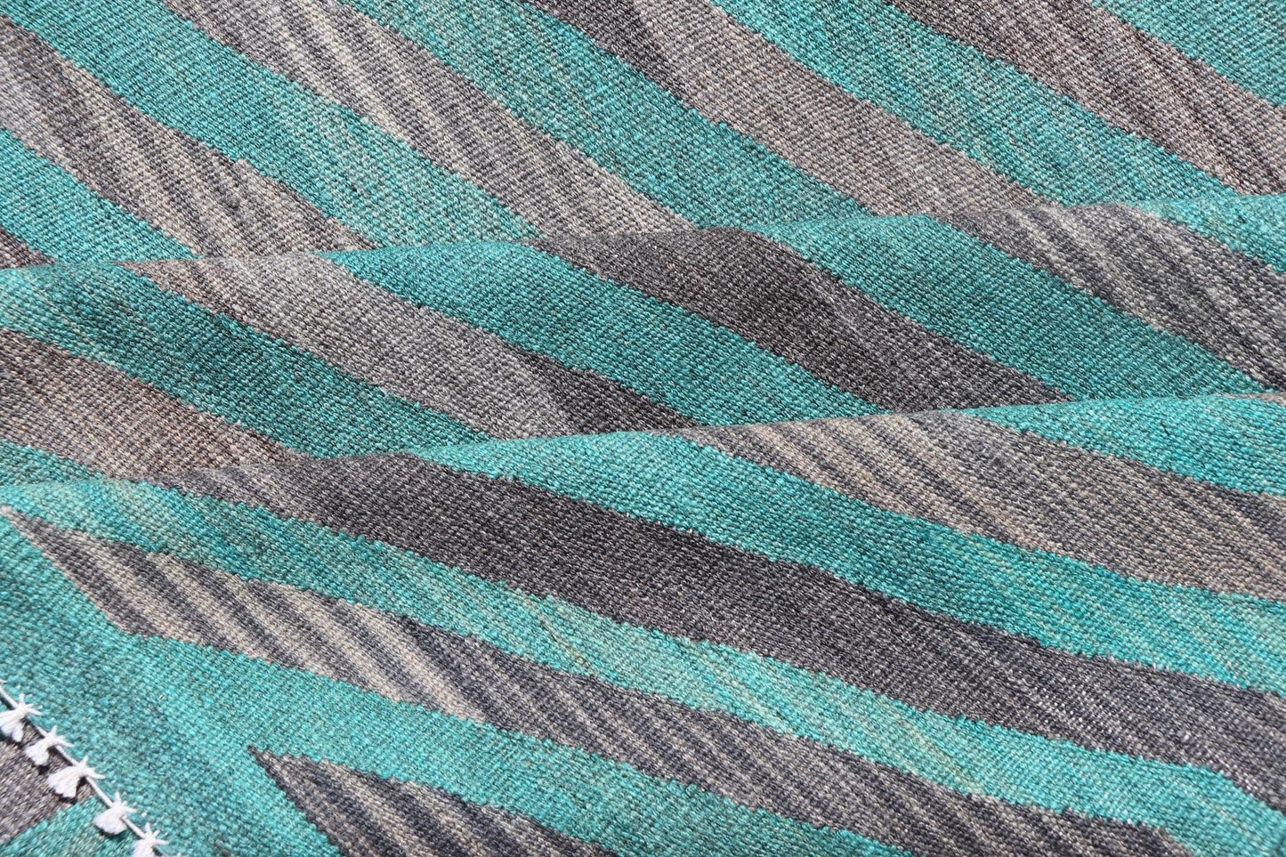 Modern Afghan Hand - Woven Kilim in Wool with Sub - Geometric Slanted Stripe Design This flat - weave kilim has been hand - woven. The rug features a modern slanted stripe design, rendered in green and shades of gray; making this rug a superb fit for a... - Keivan Woven ArtsAFG - 044 - 19676Rug