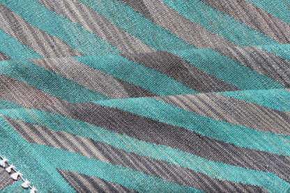 Modern Afghan Hand - Woven Kilim in Wool with Sub - Geometric Slanted Stripe Design This flat - weave kilim has been hand - woven. The rug features a modern slanted stripe design, rendered in green and shades of gray; making this rug a superb fit for a... - Keivan Woven ArtsAFG - 044 - 19676Rug