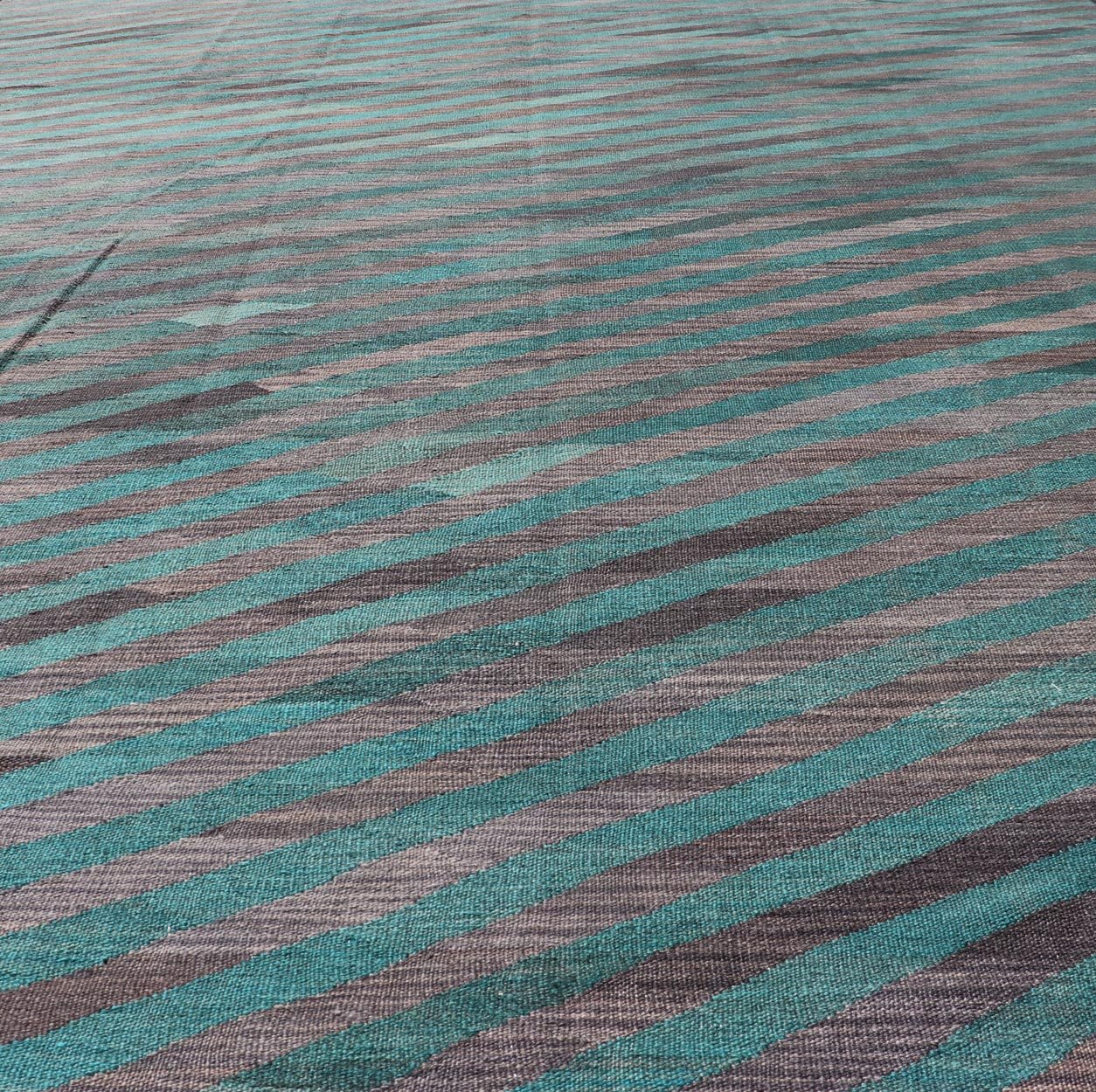 Modern Afghan Hand - Woven Kilim in Wool with Sub - Geometric Slanted Stripe Design This flat - weave kilim has been hand - woven. The rug features a modern slanted stripe design, rendered in green and shades of gray; making this rug a superb fit for a... - Keivan Woven ArtsAFG - 044 - 19676Rug