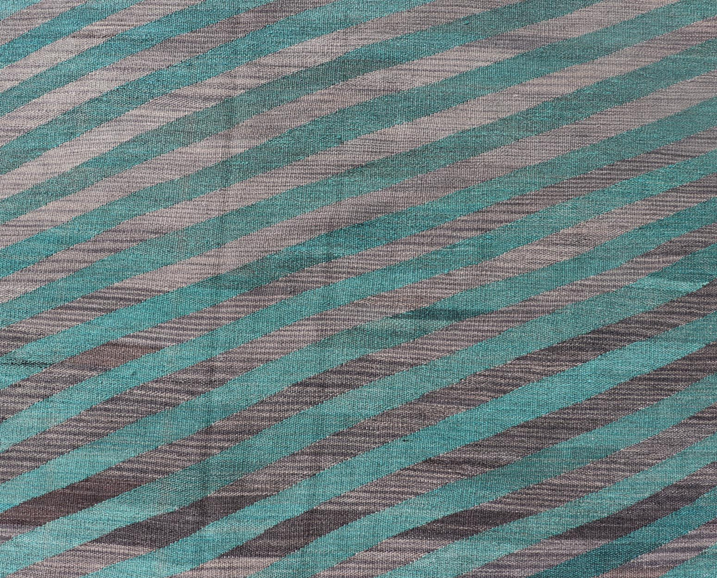 Modern Afghan Hand - Woven Kilim in Wool with Sub - Geometric Slanted Stripe Design This flat - weave kilim has been hand - woven. The rug features a modern slanted stripe design, rendered in green and shades of gray; making this rug a superb fit for a... - Keivan Woven ArtsAFG - 044 - 19676Rug