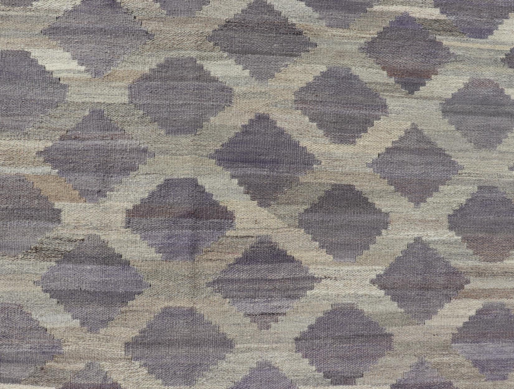 Modern Hand - Woven Flatweave Kilim in Wool with All - Over Geometric Diamond Design This flat - weave kilim has been hand - woven. The rug features a modern all - over geometric diamond design, rendered in shades of lavender, cream and brown; making this... - Keivan Woven ArtsAFG - 128 - 19694Rug